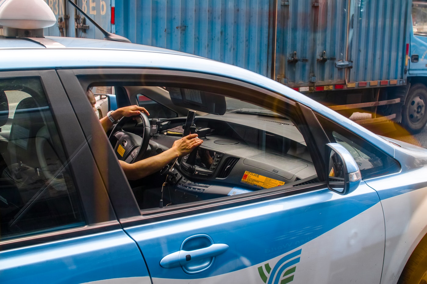 Licensed driver completing a daily vehicle check on a smartphone